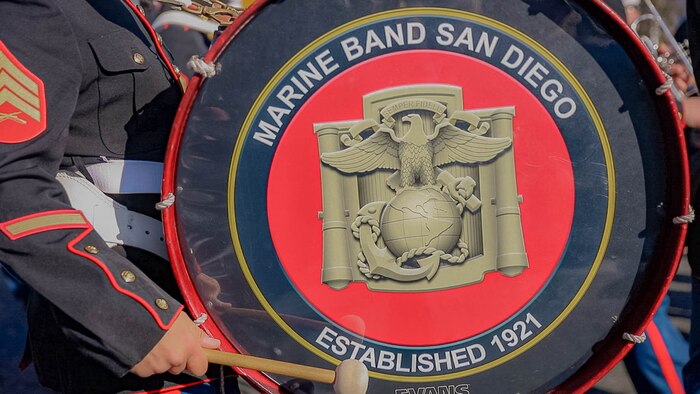 A bass drummer with Marine Band San Diego marches as a part of the U.S. Marine Corps' West Coast Composite Band during the 136th Rose Parade in Pasadena, California, Jan. 1, 2025. The Rose Parade, created to showcase the beauty of Pasadena, is part of an annual celebration, Tournament of Roses, that includes various floats, bands, dancers, and equestrian units. The Marine Corps has served the Nation honorably for 250 years. Marines embody the uncompromising standards and characteristics of honor, courage and commitment. (U.S. Marine Corps photo by Cpl. Alexandra M. Earl)