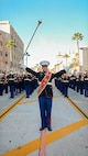 U.S. Marine Corps Gunnery Sgt. Weasley Hayes, drum major, Marine Band San Diego, marches with the West Coast Composite Band in the 136th Rose Parade in Pasadena, California, Jan. 1, 2025. The Rose Parade, created to showcase the beauty of Pasadena, is part of an annual celebration, Tournament of Roses, that includes various floats, bands, dancers and equestrian units. The Marine Corps has served the Nation honorably for 250 years. Marines embody the uncompromising standards and characteristics of honor, courage and commitment. (U.S. Marine Corps photo by Cpl. Alexandra M. Earl)
