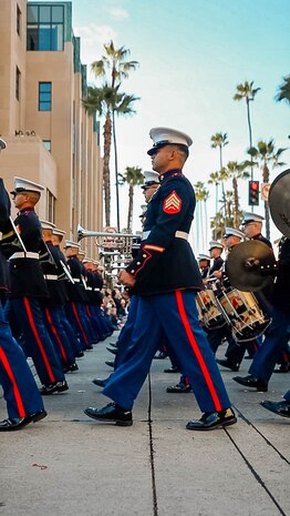 The U.S. Marine Corps' West Coast Composite Band marches in the 136th Rose Parade in Pasadena, California, Jan. 1, 2025. The Rose Parade, created to showcase the beauty of Pasadena, is part of an annual celebration, Tournament of Roses, that includes various floats, bands, dancers and equestrian units. The Marine Corps has served the Nation honorably for 250 years. Marines embody the uncompromising standards and characteristics of honor, courage and commitment. (U.S. Marine Corps photo by Cpl. Alexandra M. Earl)