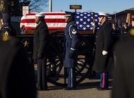 Service members in state funeral procession.
