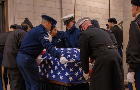 Service members in state funeral procession.