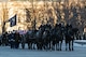 A ceremonial Honor Guard Joint Service Casket Team leads Former President Jimmy Carter on a caisson during the procession service at the U.S. Navy Memorial Plaza, Washington, D.C.