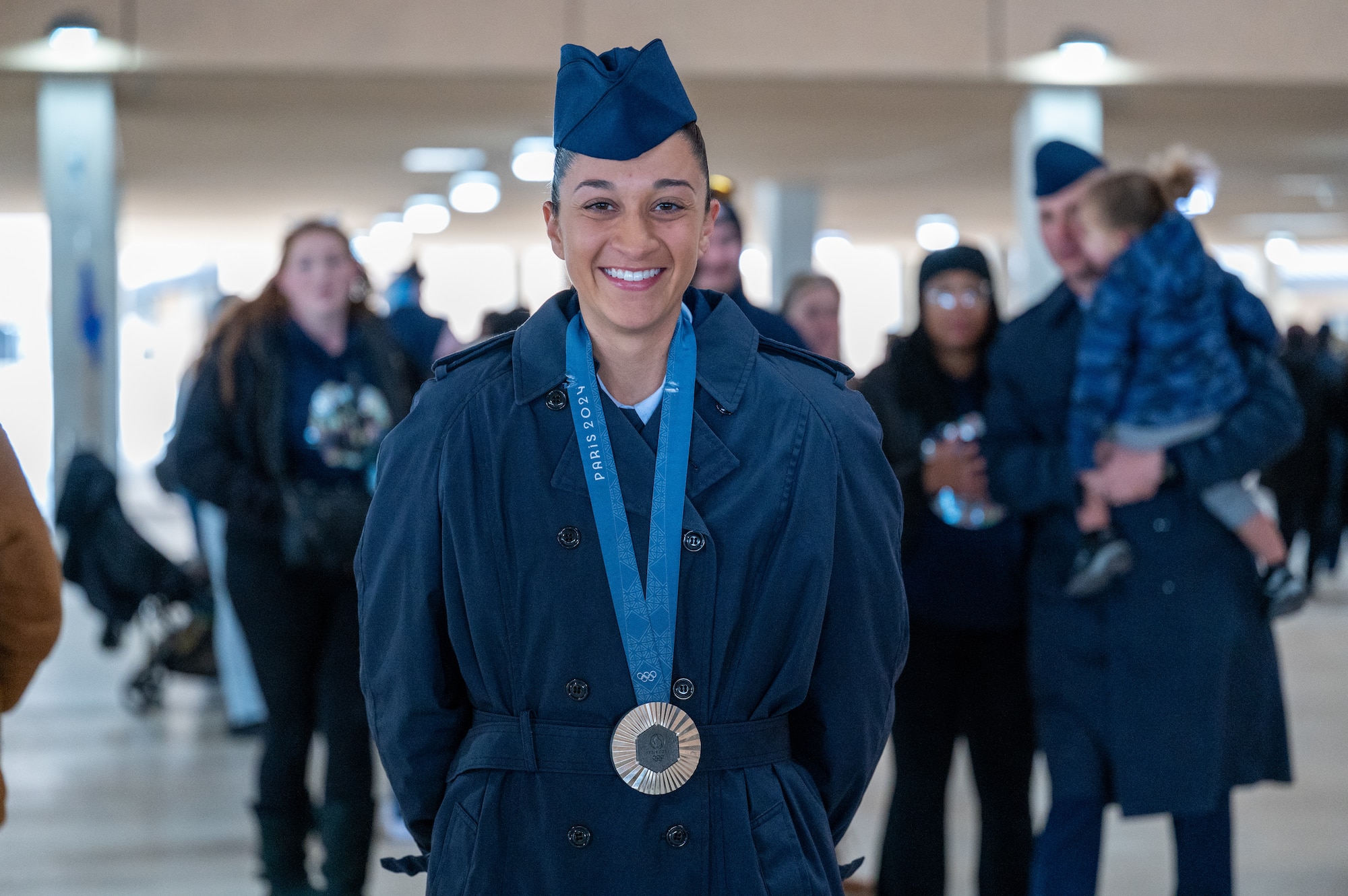 Airman Anita Alvarez poses for a photo with her 2024 Paris Olympics silver medal