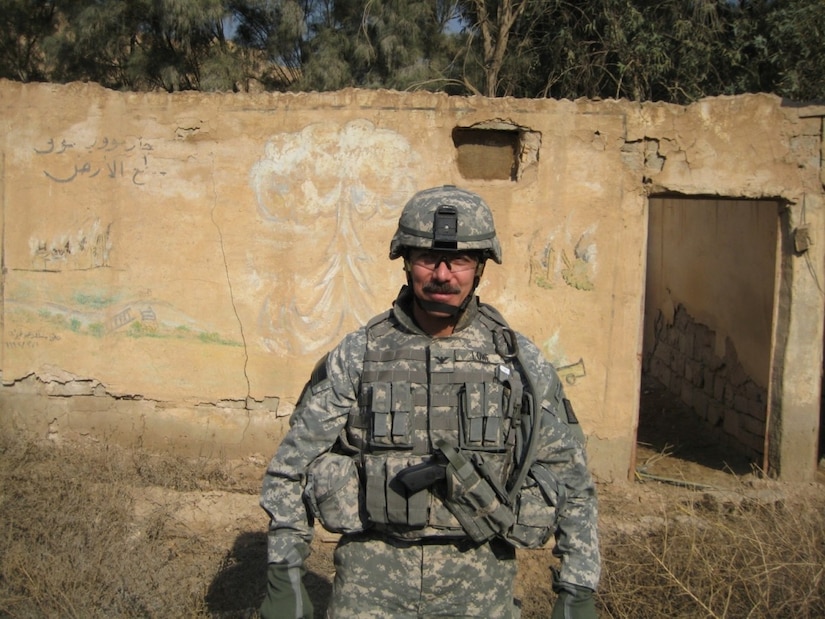 A soldier poses for a photo.