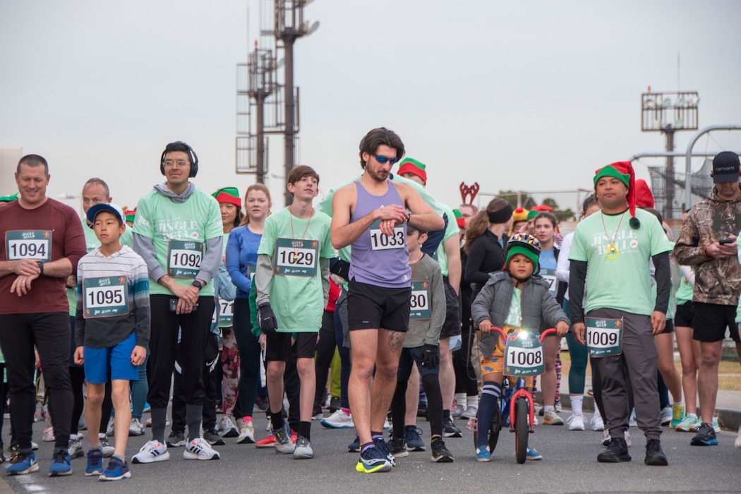 Yokosuka Sailors, their family members and friends participate in Commander, Fleet Activities Yokosuka’s (CFAY) Jingle Bell 5K Run at the installation’s Purdy Gym Pavilion.