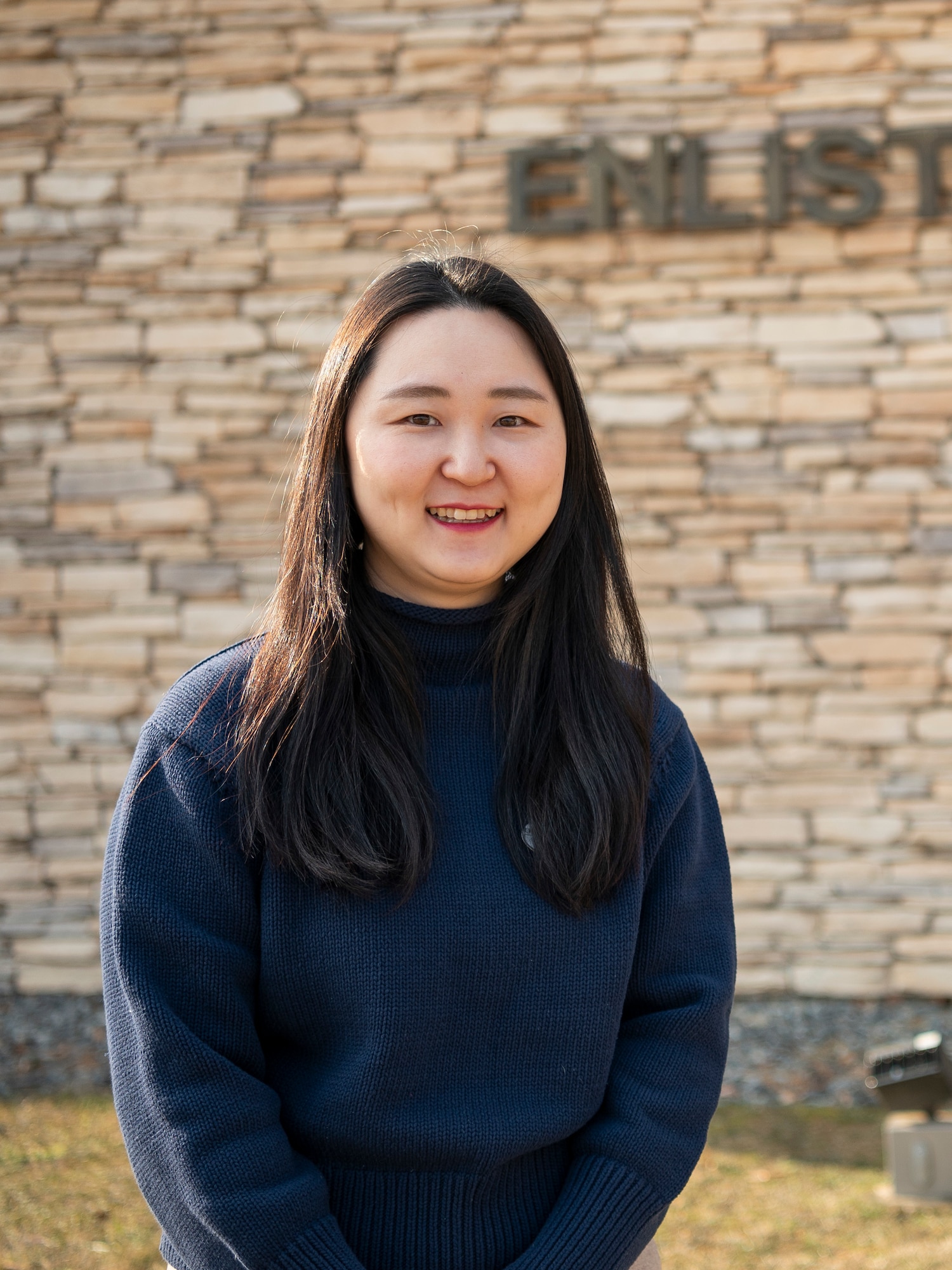 Ms. Chong, Chu Hyon, 51st Force Support Squadron administrative assistant, poses for a photo outside the enlisted club at Osan Air Base, Republic of Korea, Jan. 8, 2024. Chong was named the 51st Fighter Wing Mustang of the Week for her hard work and dedication to her unit and Osan AB. (U.S. Air Force photo by Staff Sgt. Ashley N. Mikaio)