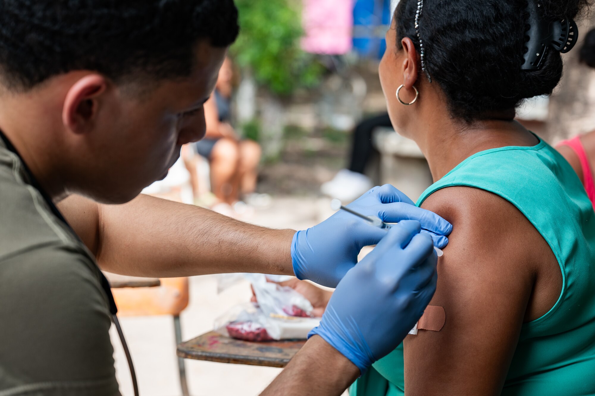 U.S. Army Spc. Jaden King, Joint Task Force-Bravo 349th Medical Detachment medic, gives a patient an immunization shot during a Medical Readiness Training Exercise in Choluteca, Honduras, January 8, 2025.