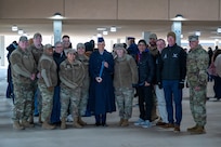 Airman Anita Alvarez smiles with her family and the leaders of Air Force Services Center and Department of the Air Force World Class Athlete Program