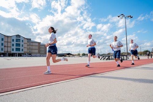 Trainee Anita Alvarez, 331st Training Squadron, leads from the front during the run portion of her official physical fitness test during week five of Basic Military Training