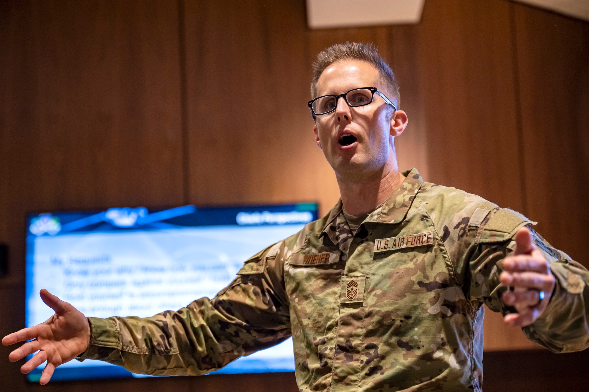 U.S. Air Force Chief Master Sgt. Joshua Wiener, Ninth Air Force (Air Forces Central) command chief, speaks to Airmen during the junior enlisted all call at Shaw Air Force Base, S.C., Dec. 19, 2024. All call sessions were held for junior enlisted, noncommissioned officers, and senior noncommissioned officers to connect with and educate Airmen on their roles in the AFCENT mission. (U.S. Air Force photo)
