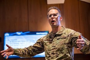 U.S. Air Force Chief Master Sgt. Joshua Wiener, Ninth Air Force (Air Forces Central) command chief, speaks to Airmen during the junior enlisted all call at Shaw Air Force Base, S.C., Dec. 19, 2024. All call sessions were held for junior enlisted, noncommissioned officers, and senior noncommissioned officers to connect with and educate Airmen on their roles in the AFCENT mission. (U.S. Air Force photo)
