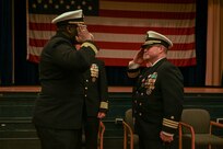 U.S. Navy Cmdr. James Koffi relieves U.S. Navy Cmdr. Chance Smith as commanding officer of the Arleigh Burke-class guided-missile destroyer USS Truxtun (DDG 103), at a change of command ceremony