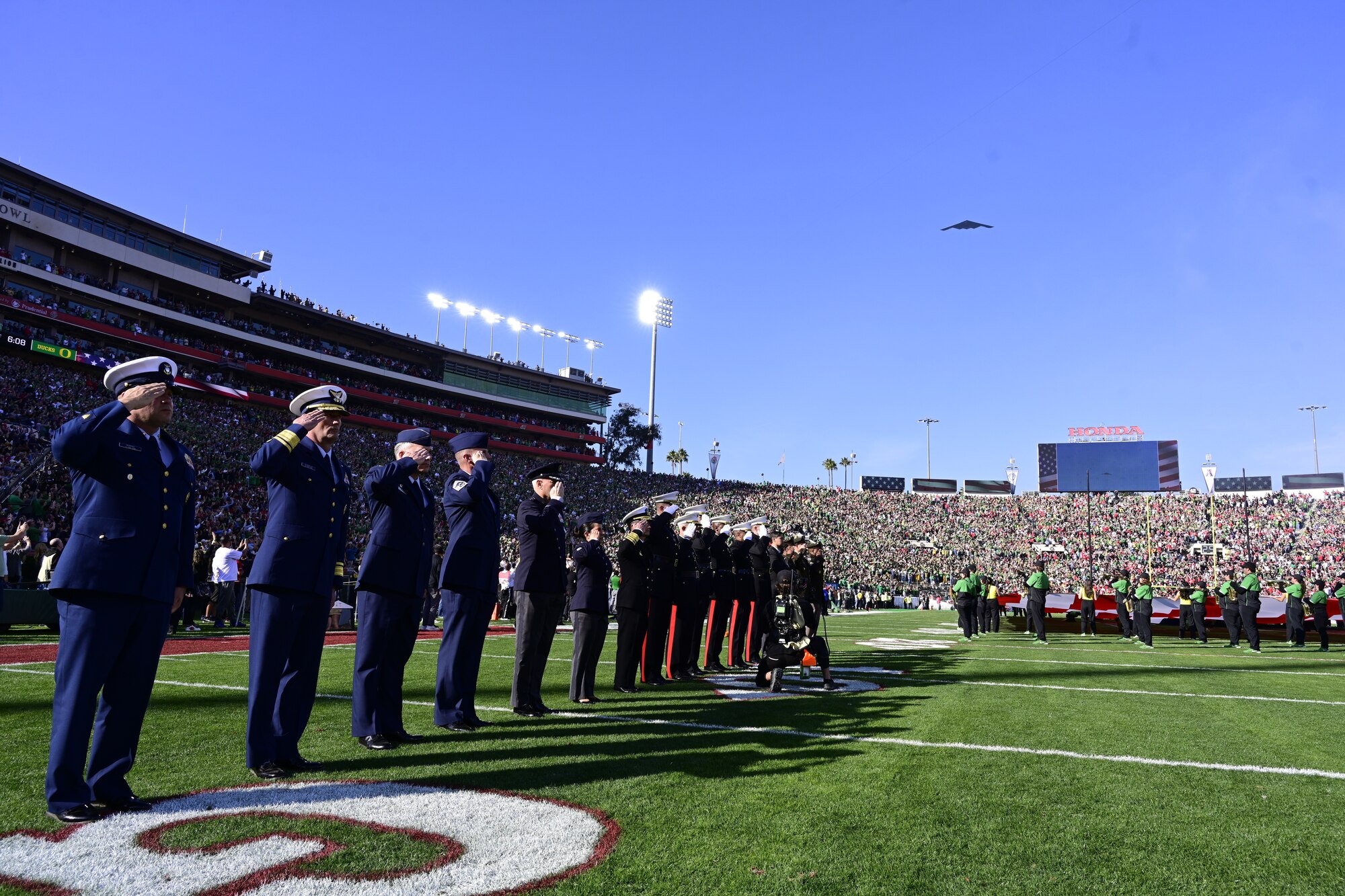 Members of the DoD participate in the opening ceremony of the  2025 Rose Bowl, Pasadena, California, Jan. 1, 2025.  Members also  participated in the Tournament of Roses Parade and the Rose Bowl to engage with the community and showcase the professionalism, readiness, and dedication of the U.S. military (U.S. Air Forces photo by Tech. Sgt. Heather Salazar)