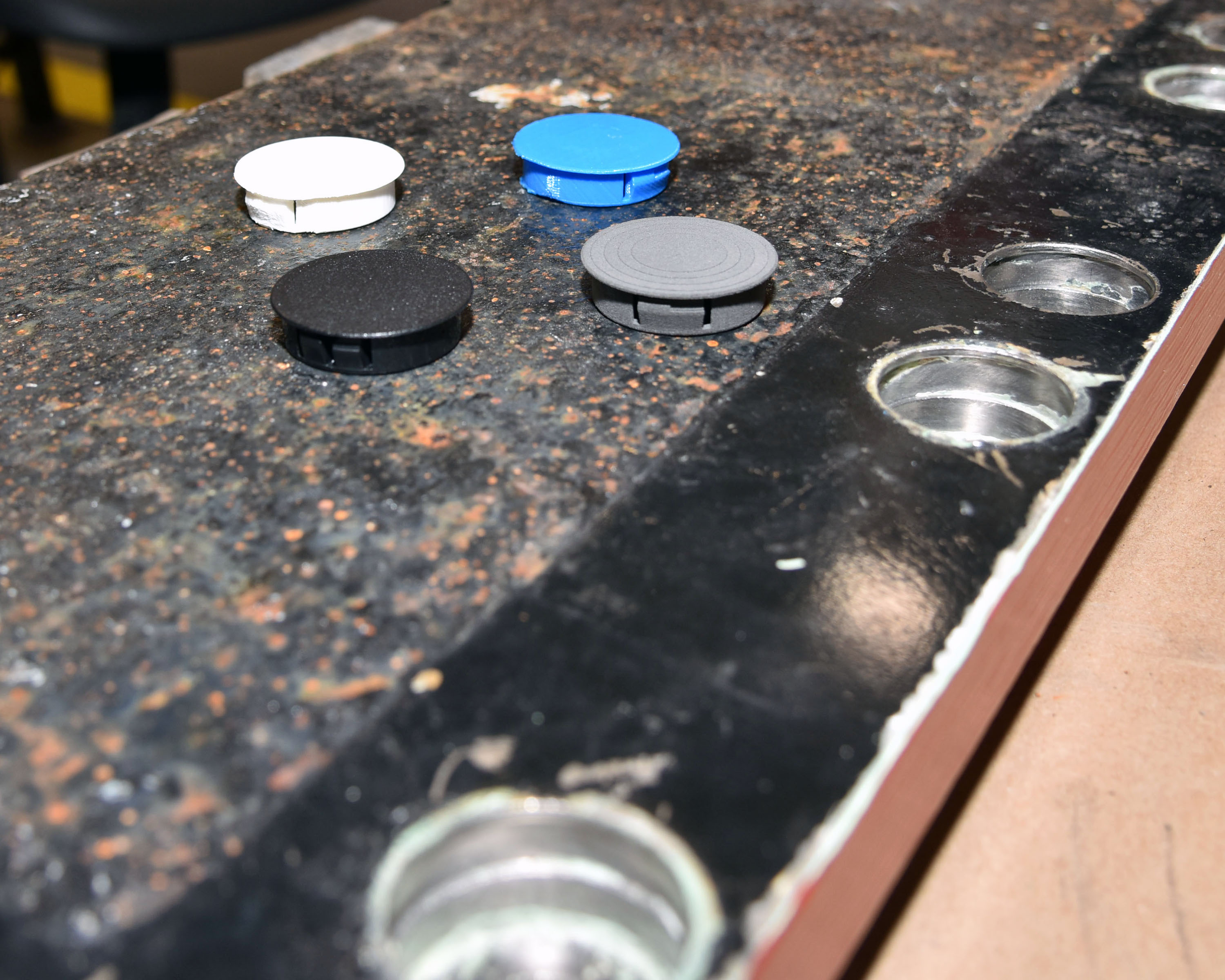 Commander, Submarine Forces is researching the usage of additive manufacturing (AM) technology to address operational needs after identifying a need for plastic dust caps, a material item essential for submarine maintenance, in collaboration with midshipmen from the U.S. Naval Academy (USNA), Submarine Squadron Two (CSS-2), Submarine Squadron Four (CSS-4), and the Portsmouth Naval Shipyard (PNSY).