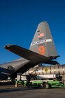 Airmen load the Modular Airborne Firefighting System (MAFFS) tank into a C-130 aircraft.