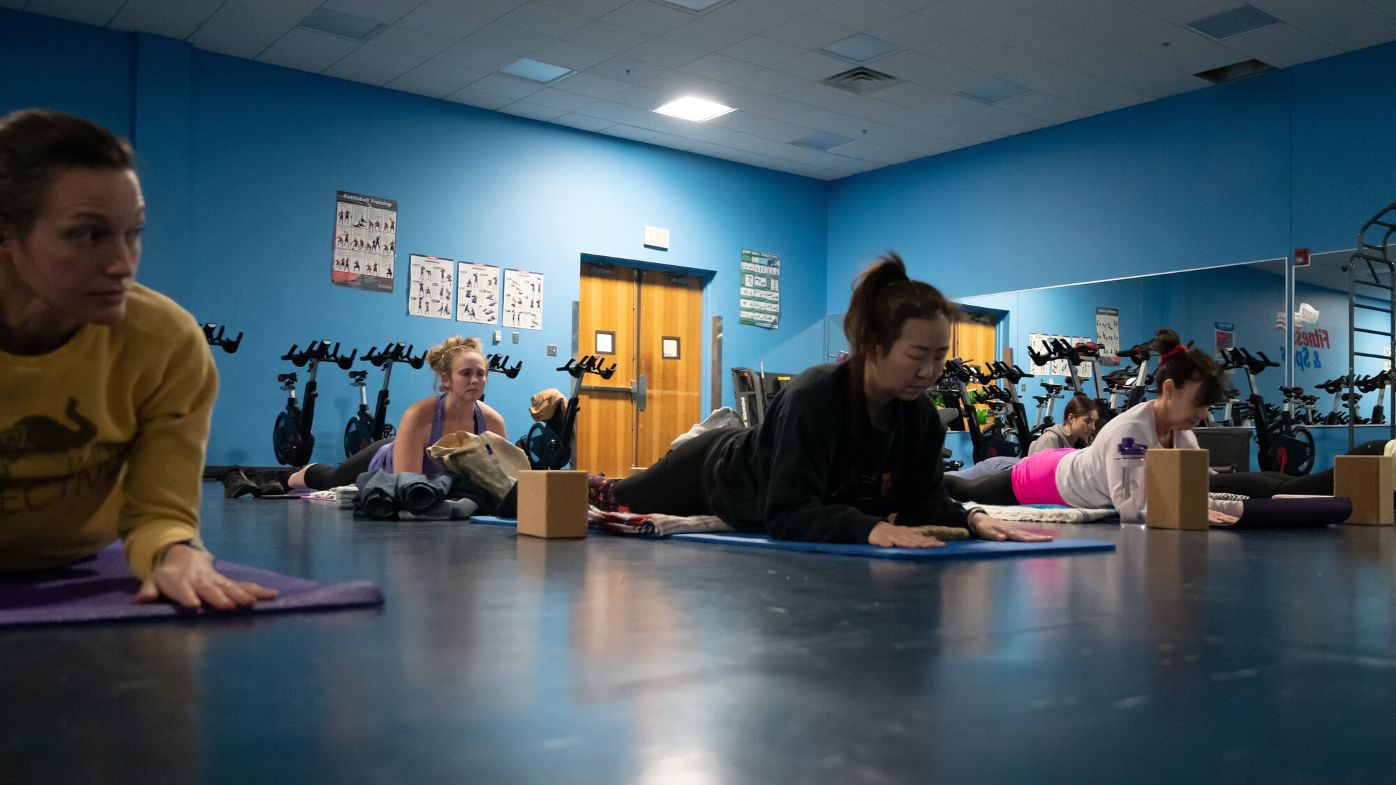 Students execute a cobra pose during a yin yoga class at the McGuire Fitness Center, Joint Base McGuire-Dix-Lakehurst, N.J., Jan. 8, 2025. Military and civilian personnel at JB MDL kicked off 2025 by strengthening their fitness, united in the mission to get fit for the fight. (U.S. Air Force photo by Susan Moriarty)