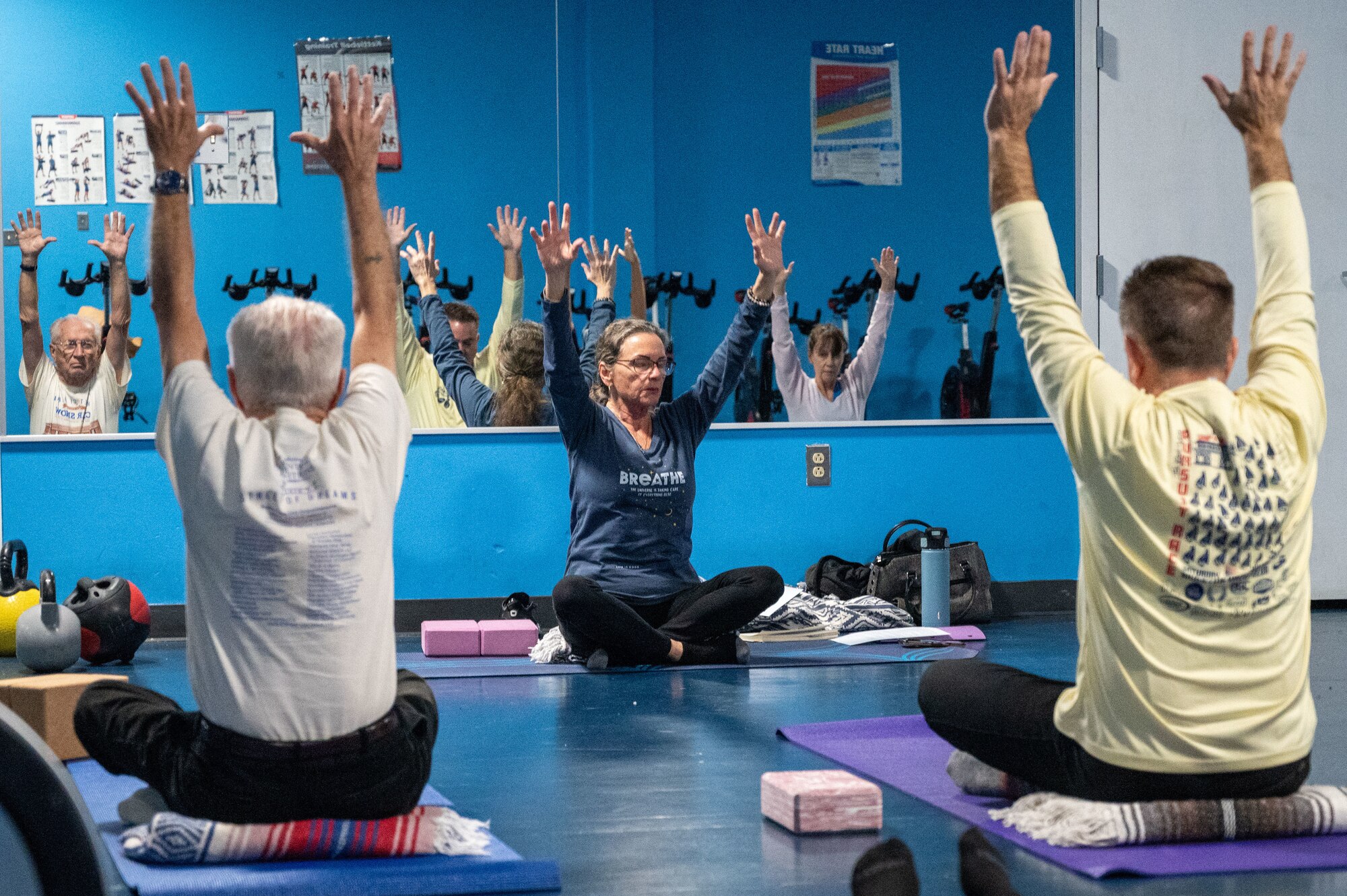 Patricia Murgolo, registered  yoga teacher volunteer and Gold Star parent, leads students in a yin yoga class at the McGuire Fitness Center, Joint Base McGuire-Dix-Lakehurst, N.J., Jan. 8, 2025. Military and civilian personnel at JB MDL kicked off 2025 by strengthening their fitness, united in the mission to get fit for the fight. (U.S. Air Force photo by Susan Moriarty)