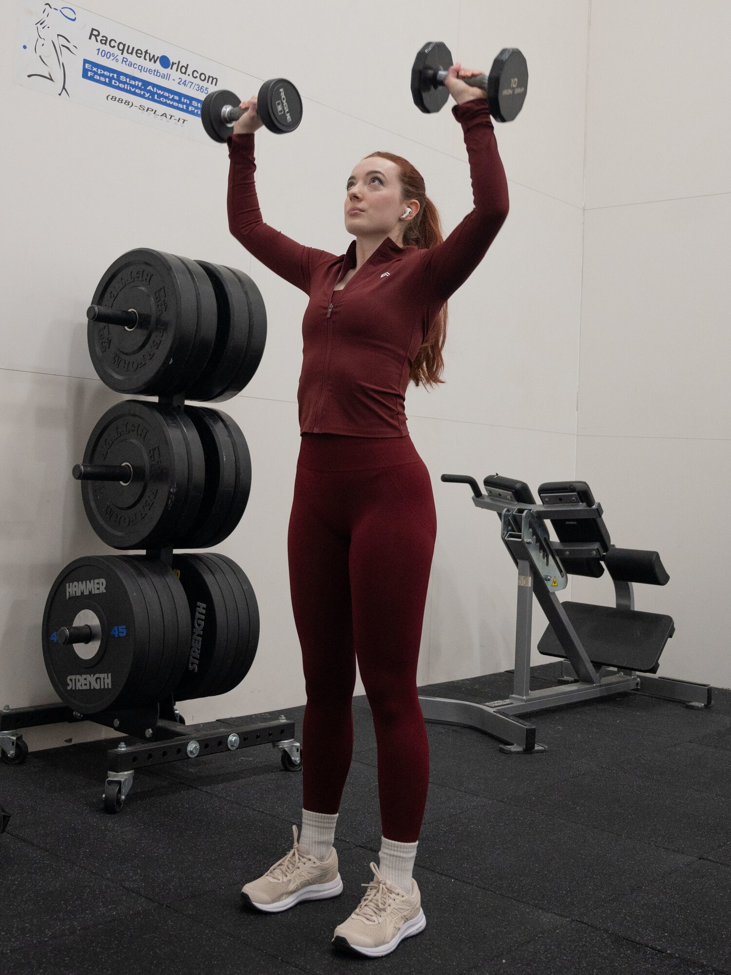 Hannah Hill   lifts free weights at the McGuire Fitness Center, Joint Base McGuire-Dix-Lakehurst, N.J., Jan. 8, 2025. Military personnel and civilians at JB MDL kicked off 2025 by strengthening their fitness, united in the mission to get fit for the fight. (U.S. Air Force photo by Susan Moriarty)