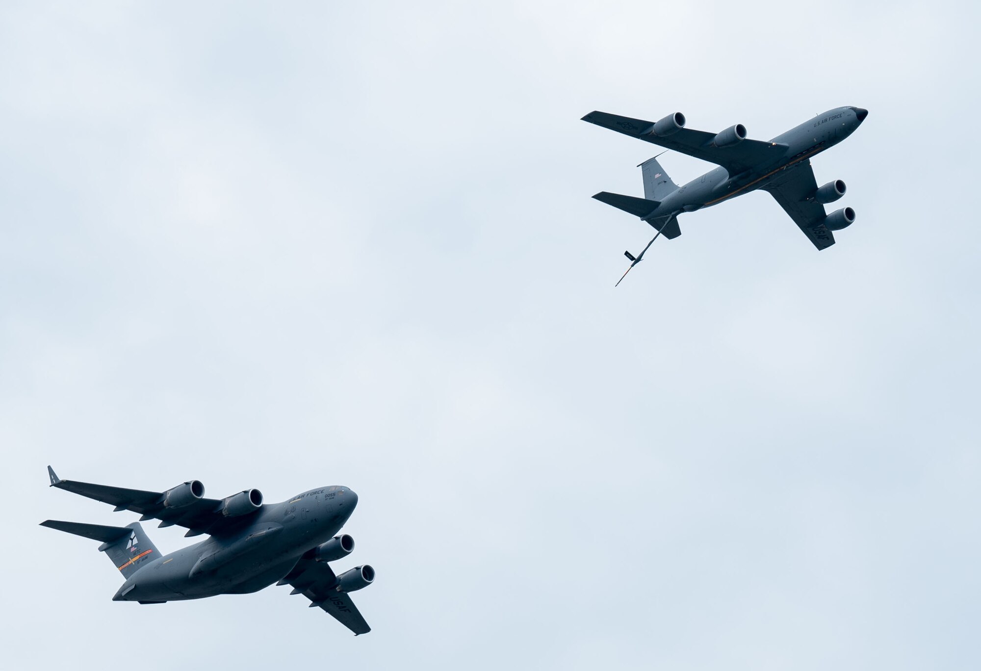 A C-17 Globemaster III and a KC-135 Stratotanker perform a refueling exercise over the Tinker Airshow, Oklahoma July 1, 2023.