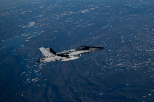 A Royal Canadian Air Force CF-18 Hornet aircraft assigned to 3 Wing Bagotville participates in the joint training exercise Operation Crimson Snowman over Saguenay-Lac-Saint-Jean, Quebec, Nov. 14, 2024. The joint training focused on the capabilities of the KC-46 Pegasus aircraft, with a significant emphasis on aerial refueling—a critical specialty the RCAF is poised to adopt and begin operations in 2027. (U.S. Air Force photo by Tech. Sgt. Monica Roybal)