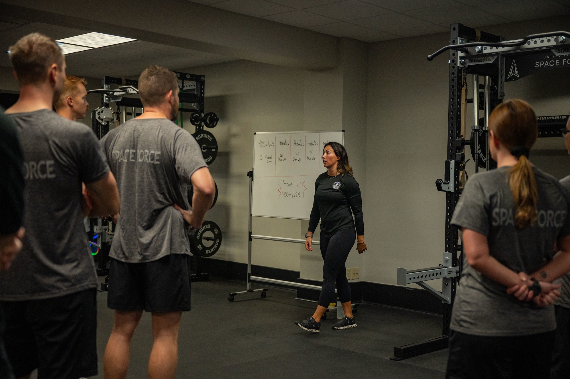 Catherine Wallace, Space Launch Delta 45 Guardian Resiliency Team strength and conditioning specialist, discusses workout specifics inside the Fitness Center at Patrick Space Force Base, Florida, Jan. 10, 2025. The SLD 45 GRT supports Guardian‘s overall well-being and readiness by providing resources and strategies to enhance their physical, mental and emotional resilience.