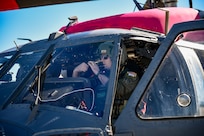 U.S. Air Force Airmen with the 129th Rescue Wing, California Air National Guard, at Moffett Air National Guard Base, Calif., prepare an HH-60G Pave Hawk helicopter to help battle the Palisades Fire Jan. 9, 2025.