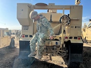 California National Guard Soldiers of the 40th Military Police Company, 49th MP Brigade, conduct preventive maintenance checks and services on an M-ATV Mine Resistant Ambush Protected vehicle at Joint Forces Training Base Los Alamitos, Calif., Jan. 8, 2025. The California Army National Guard was activated by Calif. Gov.Gavin Newsom to assist first responders to multiple fires in the Los Angeles area.