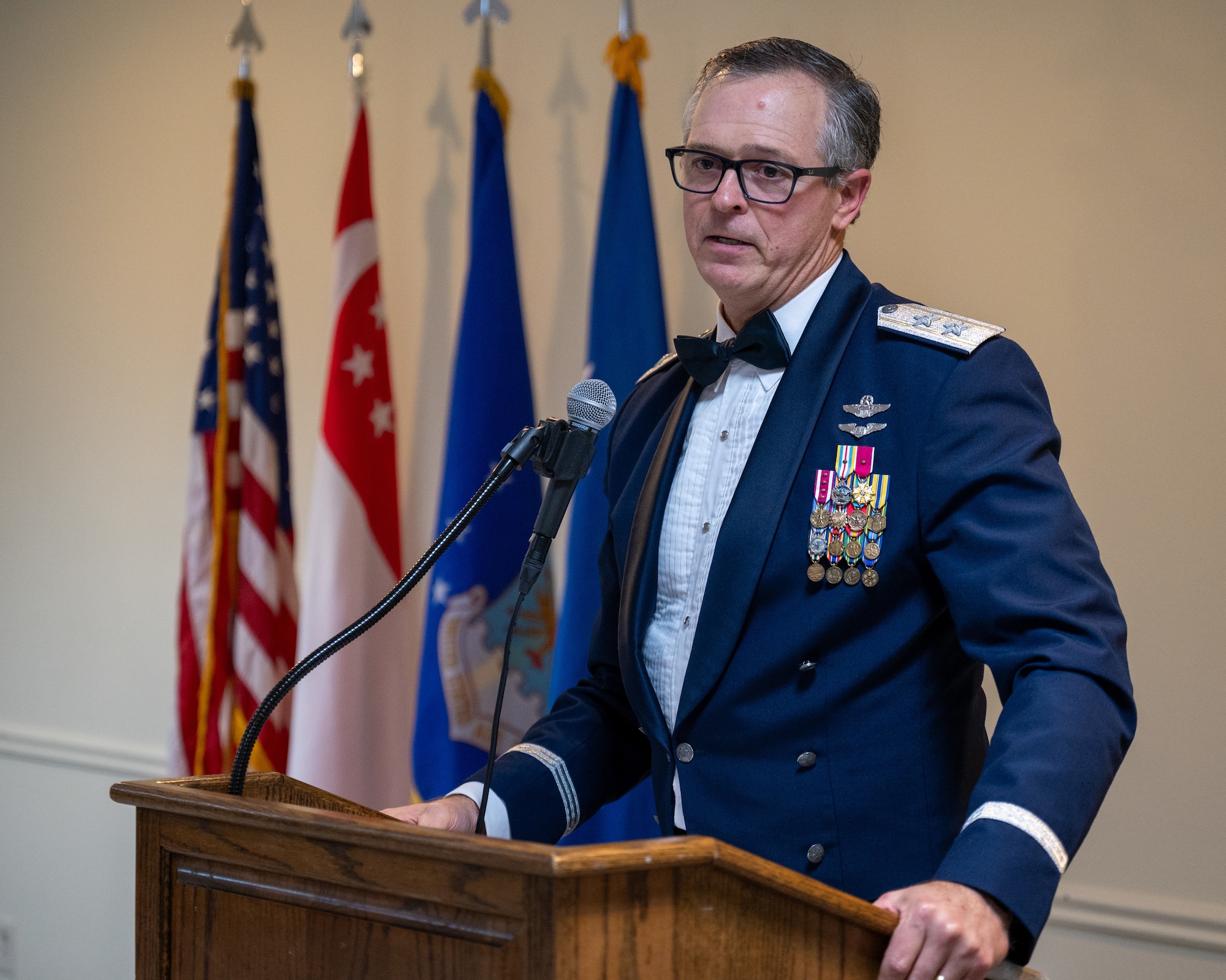 Retired U.S. Air Force Maj. Gen. Craig Wills gives a speech at the graduation of Class 24-05 at Laughlin Air Force Base, Texas, Jan. 9, 2025. Seventeen U.S. Air Force officers were awarded silver wings during the ceremony, symbolizing their completion of the Undergraduate Pilot Training program. (U.S. Air Force photo by Staff Sgt. Nicholas Larsen)