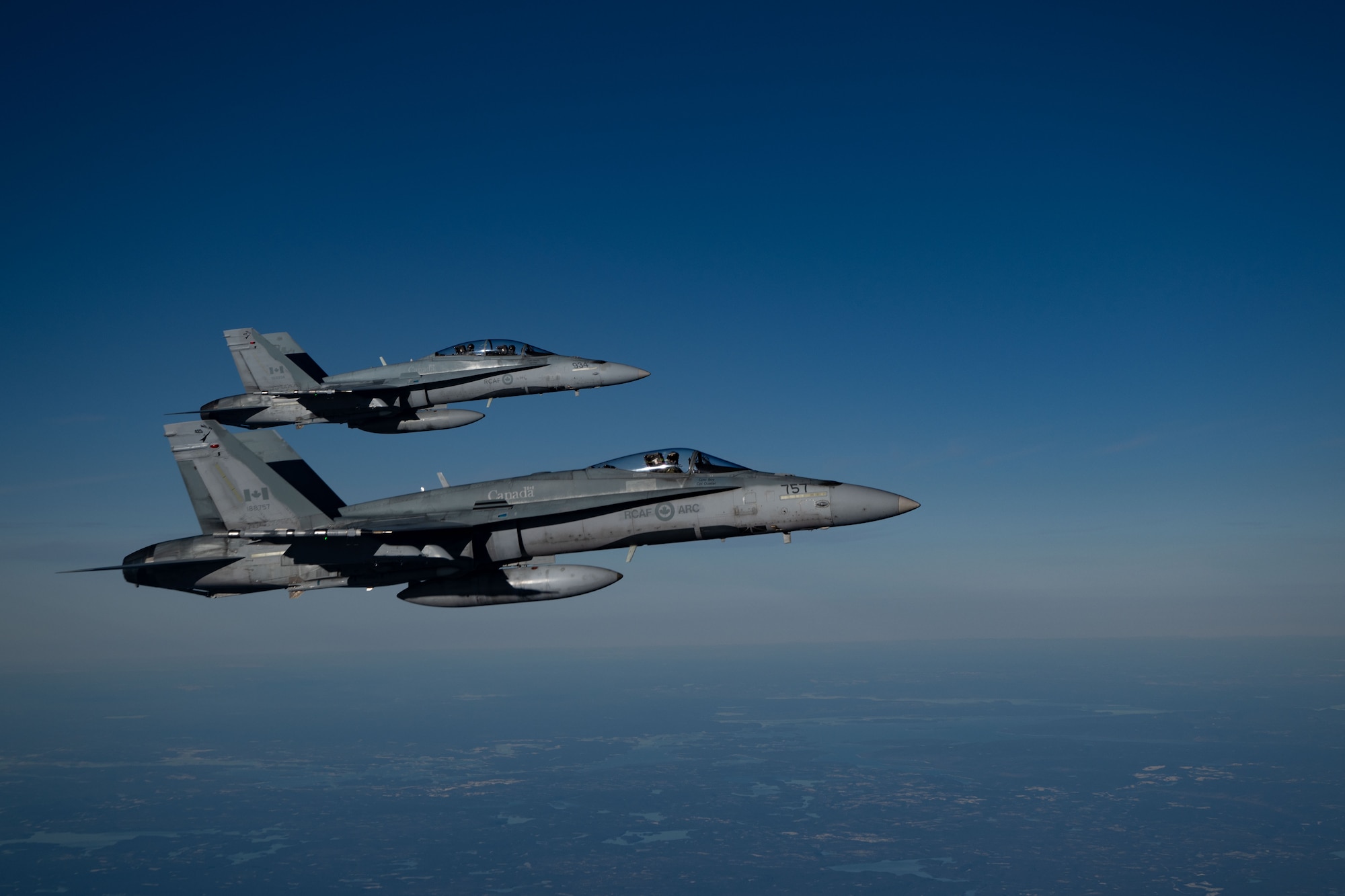 Royal Canadian Air Force CF-18 Hornet aircraft assigned to 3 Wing Bagotville participates in the joint training exercise Operation Crimson Snowman over Saguenay-Lac-Saint-Jean, Quebec, Nov. 14, 2024. The joint training focused on the capabilities of the KC-46 Pegasus aircraft, with a significant emphasis on aerial refueling—a critical specialty the RCAF is poised to adopt and begin operations in 2027. (U.S. Air Force photo by Tech. Sgt. Monica Roybal)