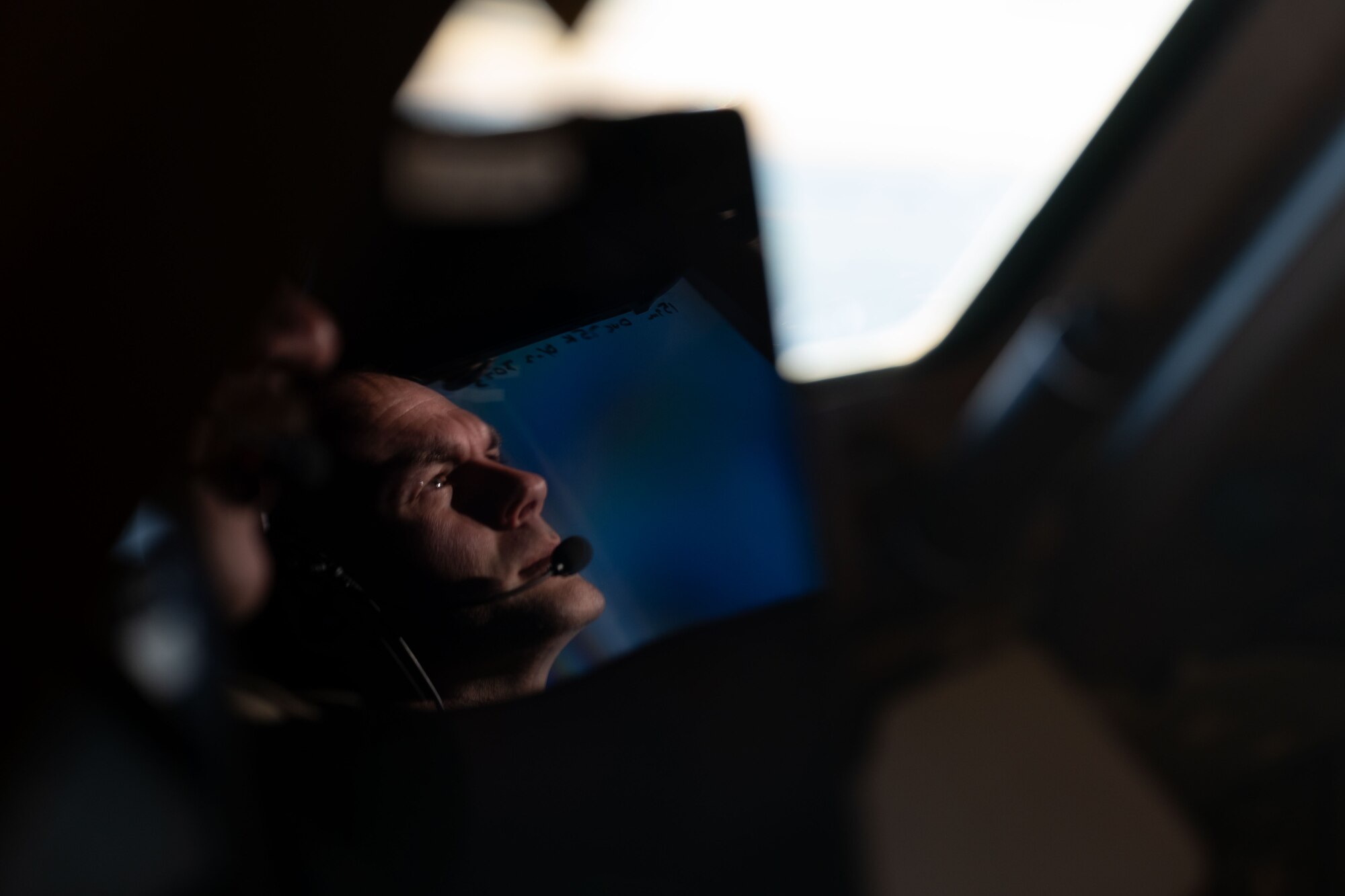 U.S. Air Force Capt. Andrew Bowles, 2nd Air Refueling Squadron KC-46A Pegasus pilot, monitors the air space during Operation Crimson Snowman over Saguenay-Lac-Saint-Jean, Quebec, Nov. 14, 2024. The joint training focused on the capabilities of the KC-46 Pegasus aircraft, with a significant emphasis on aerial refueling—a critical specialty the RCAF is poised to adopt and begin operations in 2027. (U.S. Air Force photo by Tech. Sgt. Monica Roybal)