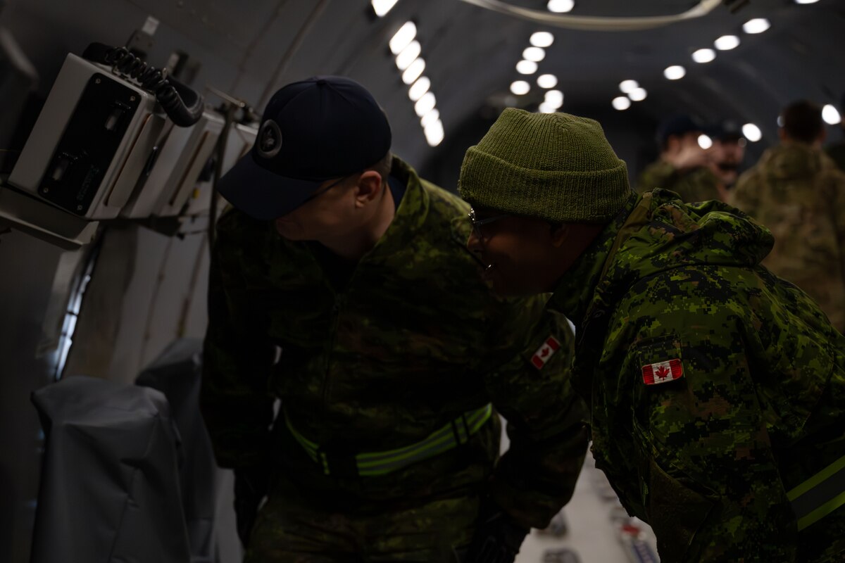 Royal Canadian Air Force members tour a KC-46A Pegasus aircraft during joint training exercise Operation Crimson Snowman at Canadian Forces base Trenton, Ontario, Nov. 15, 2024. The 2nd Air Refueling Squadron staged two KC-46A Pegasus aircraft at Canadian Forces base Trenton, Ontario, and hosted Canadian Forces members during mission orientation opportunities. (U.S. Air Force photo by Tech. Sgt. Monica Roybal)