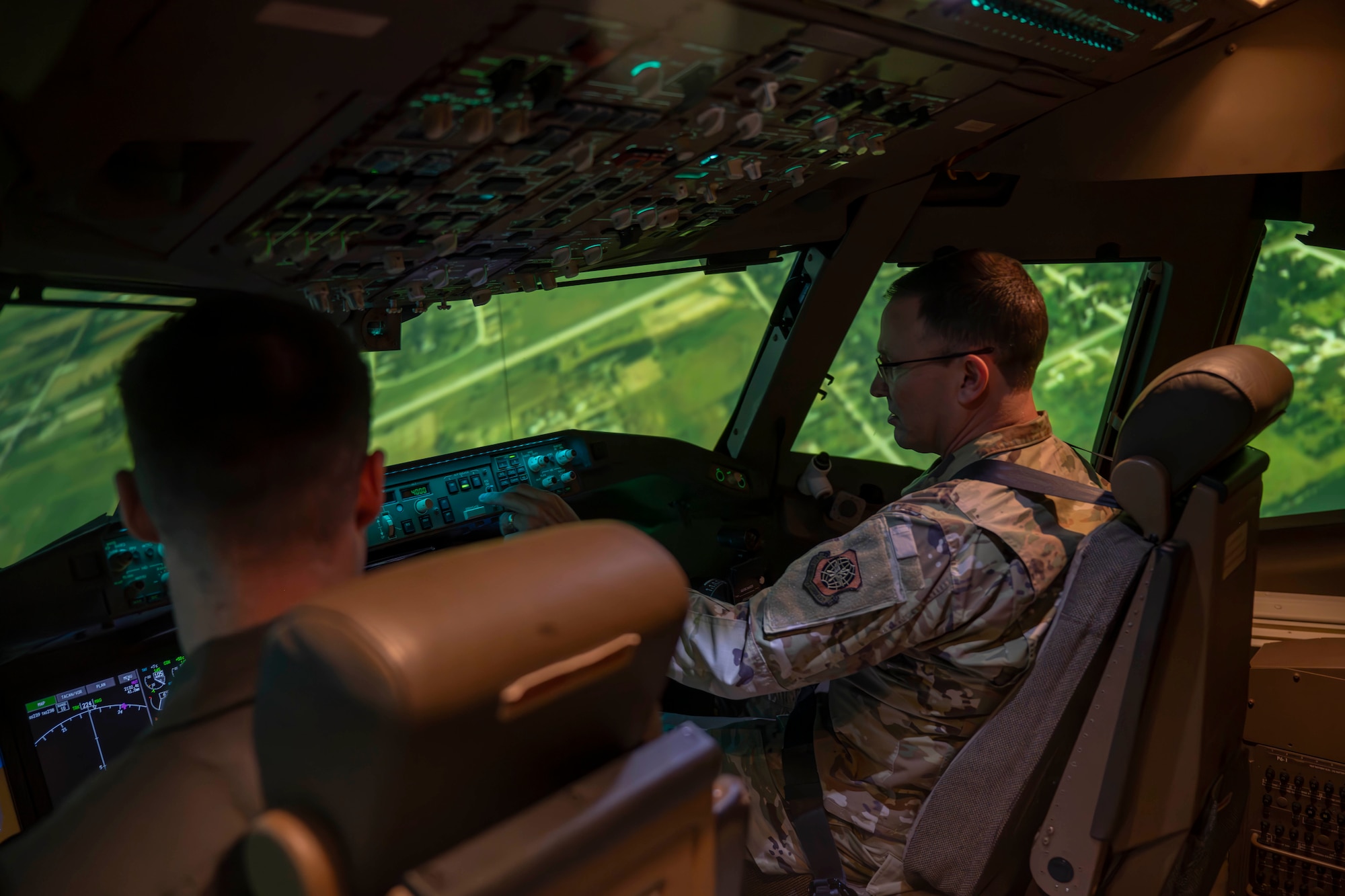 Gen. John Lamontagne, Air Mobility Command commander, participates in a KC-46A Pegasus flight simulation at McConnell Air Force Base, Kansas, Jan. 7, 2025. Lamontagne and Chief Master Sgt. Jamie Newman AMC command chief, visited McConnell for two days while visiting multiple facilities and meeting star-performing Airmen. (U.S. Air Force photo by Airman 1st Class Paula Arce)