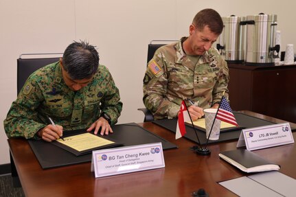 U.S. Army Pacific Deputy Commanding General Lt. Gen. Joel B. Vowell and Chief of Staff, General Staff (COS-GS), Brig. Gen. Tan Cheng Kwee signed the closing minutes during the Singapore and U.S. Army Land Force Talks on Jan. 9, 2025.