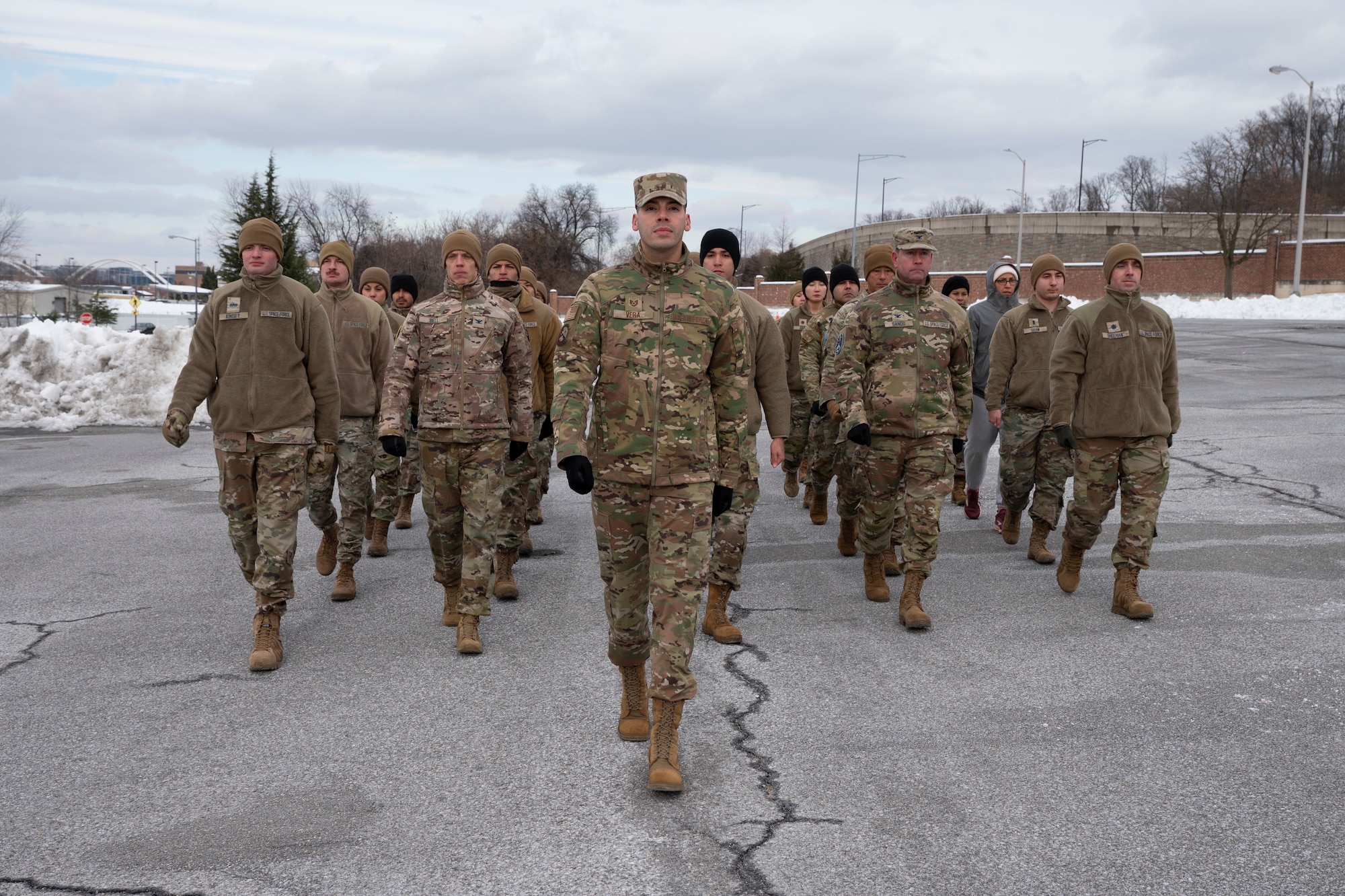 Photo of U.S. Space Force Guardians marching outside in pavement.