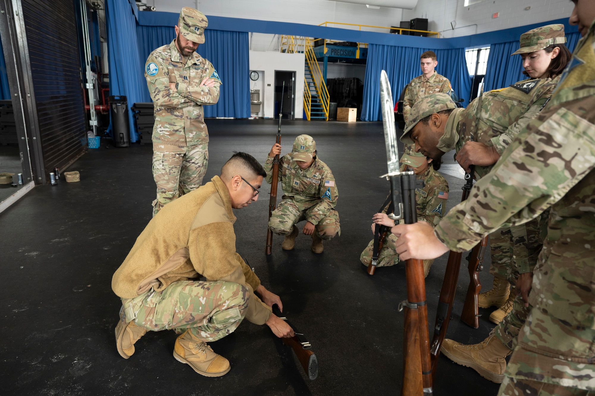Photo of an instructor training U.S. Space Force Guardians on weapon fundamentals.