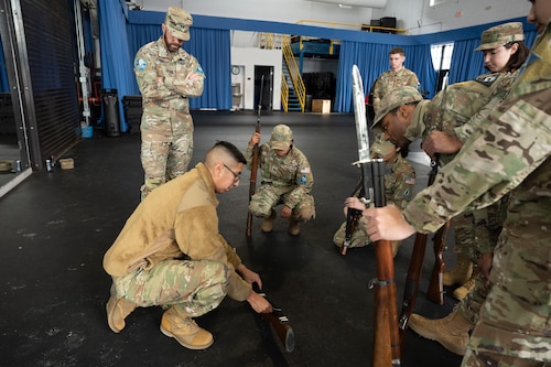 Photo of an instructor training U.S. Space Force Guardians on weapon fundamentals.