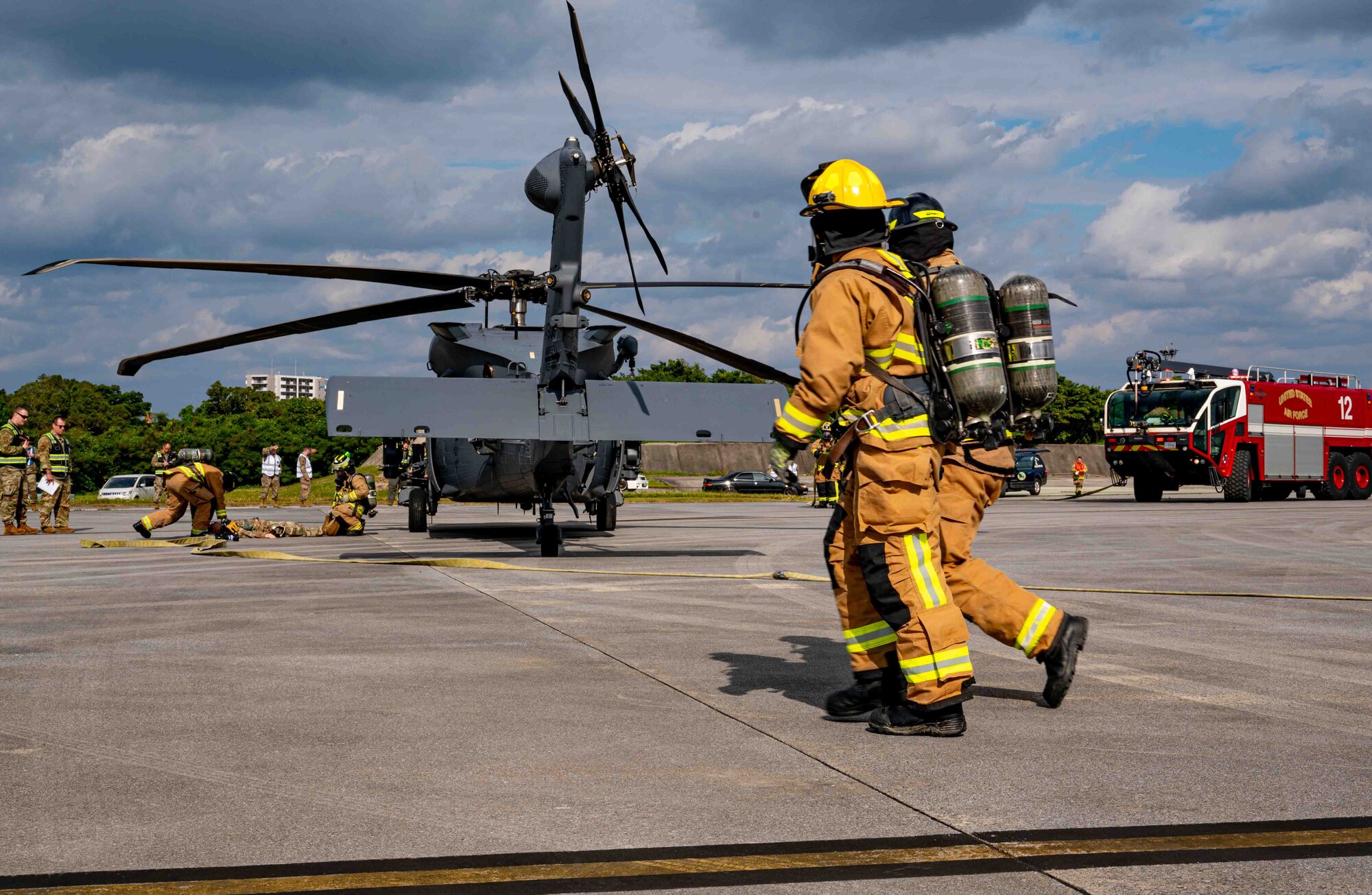 Firefighters respond to a simulated aircraft wreck.