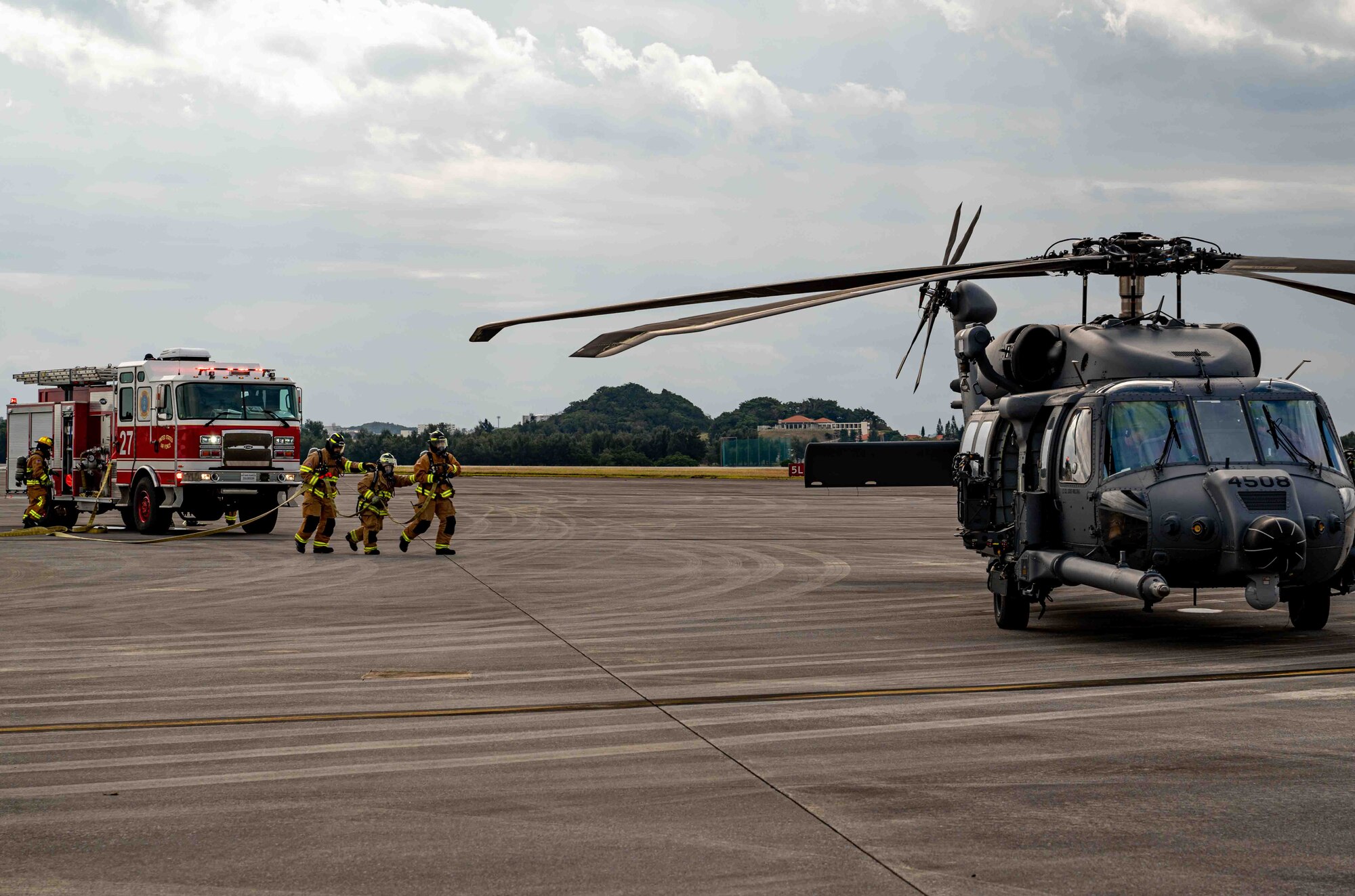 Firefighters respond to a simulated aircraft wreck.