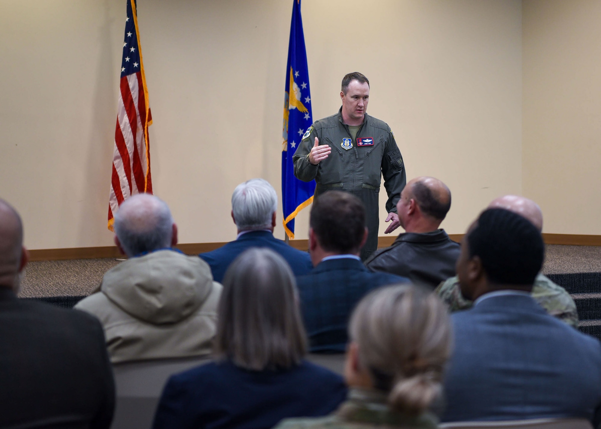 man briefing room of people