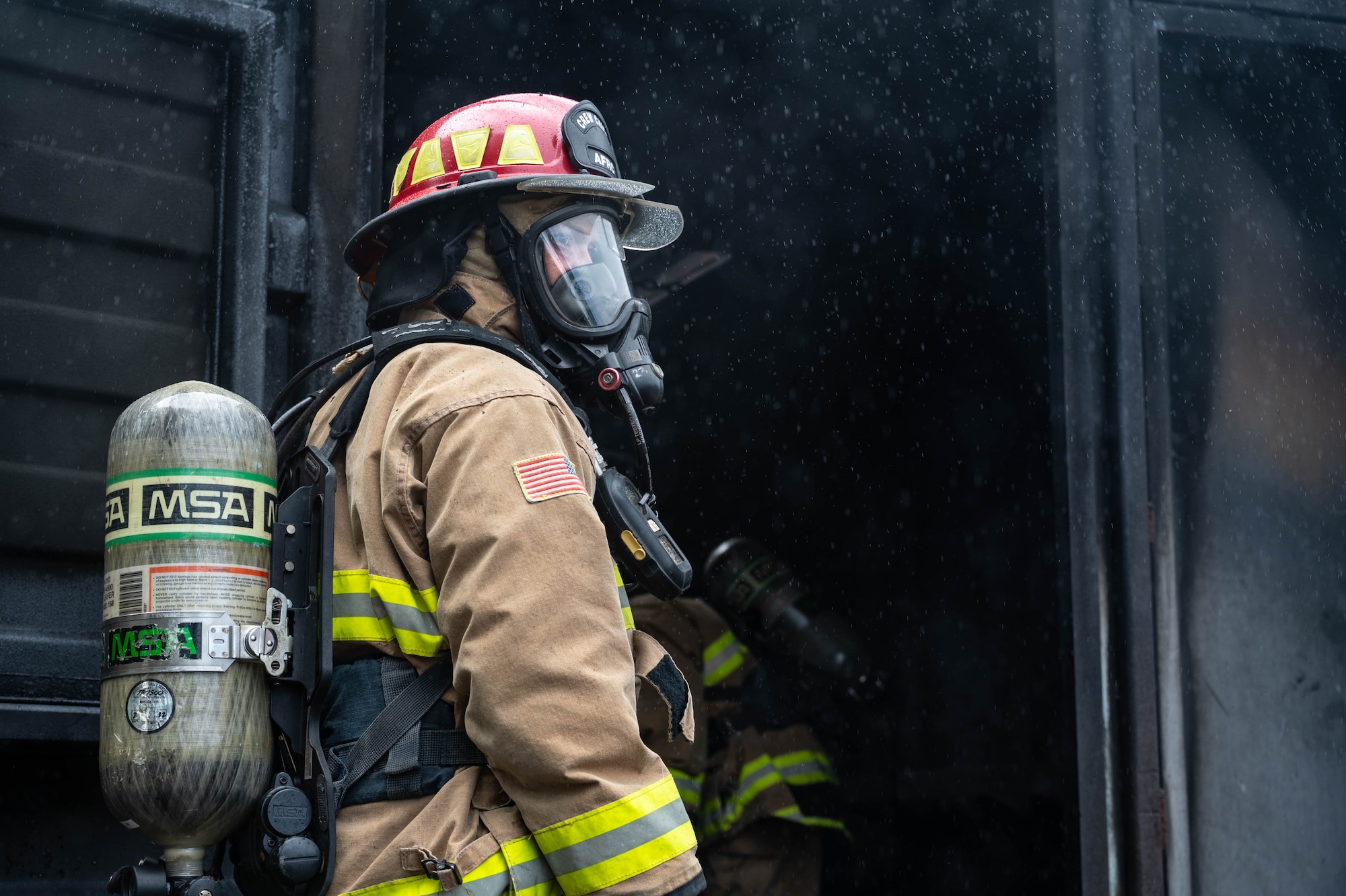 A Reserve Citizen Airman from the 624th Civil Engineering Squadron gives critical instructions while directing teammates during a live firefighting exercise in Kahului, Maui, Sept. 8, 2024.