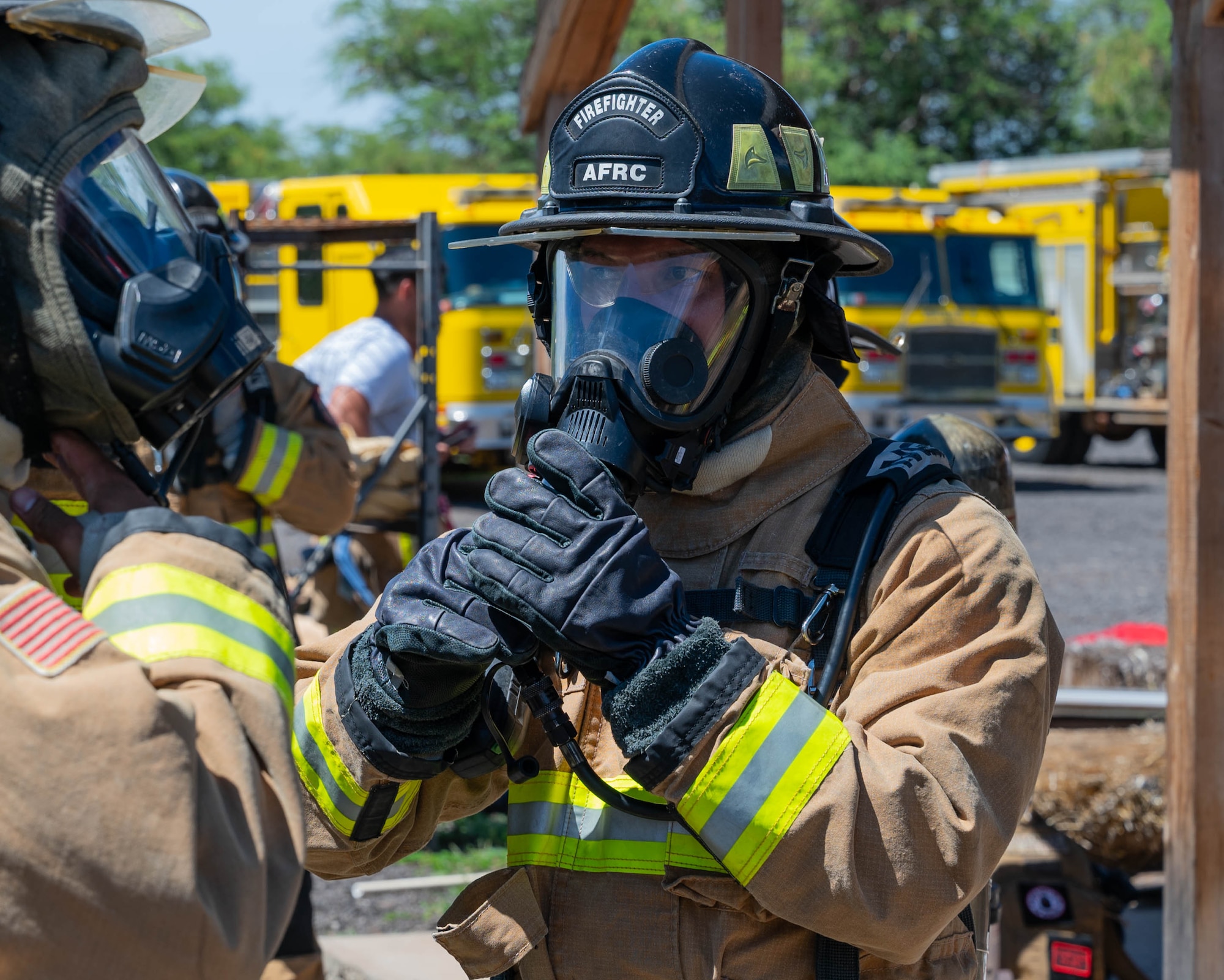 A Reserve Citizen Airman from the 624th Civil Engineering Squadron gives critical instructions while directing teammates during a live firefighting exercise in Kahului, Maui, Sept. 8, 2024.