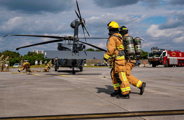 Firefighters respond to a simulated aircraft wreck.