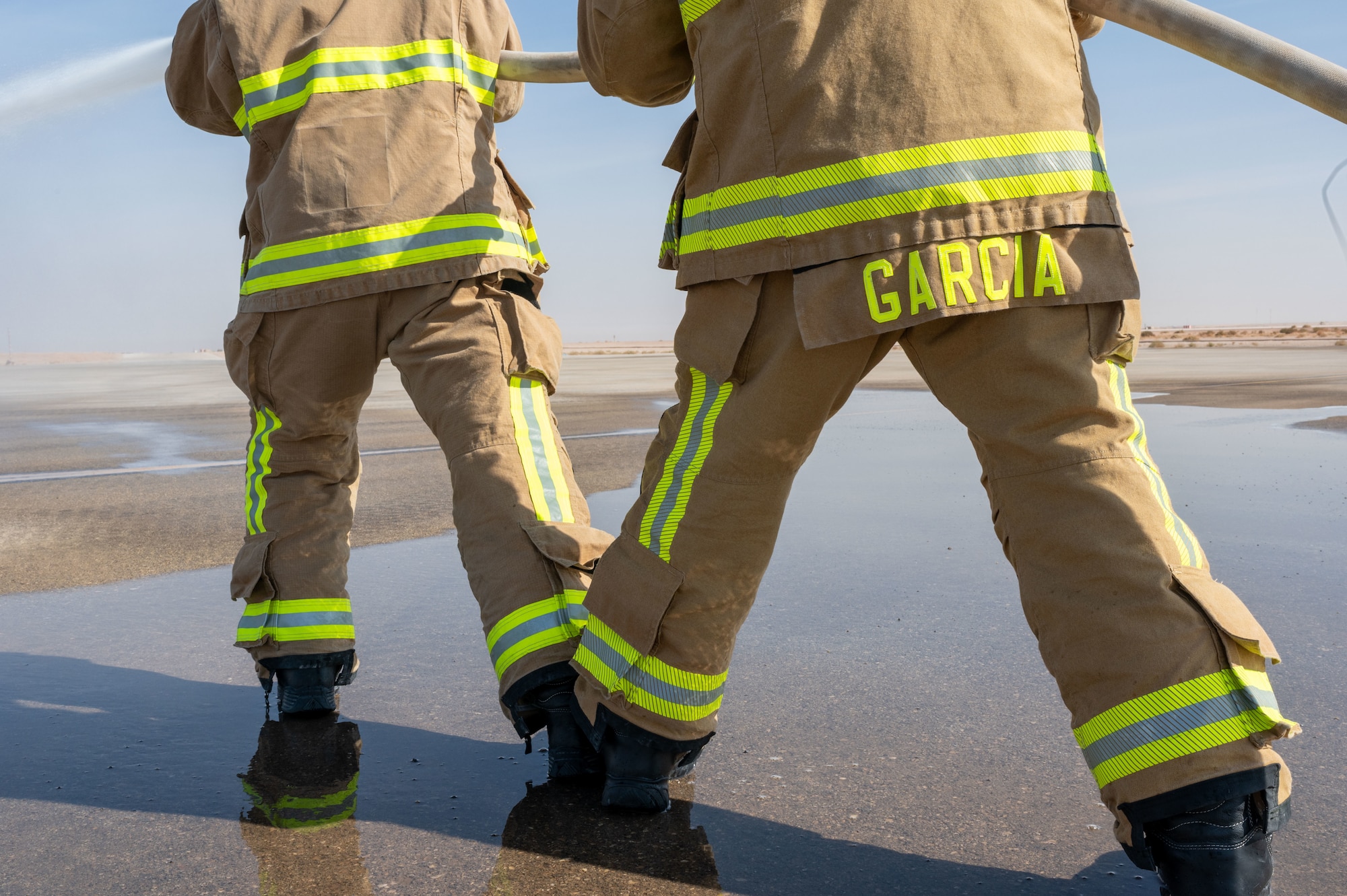 To make it easier for his partner to control where the fire hose is being aimed, Garcia typically takes the backend of the firefighting formation.