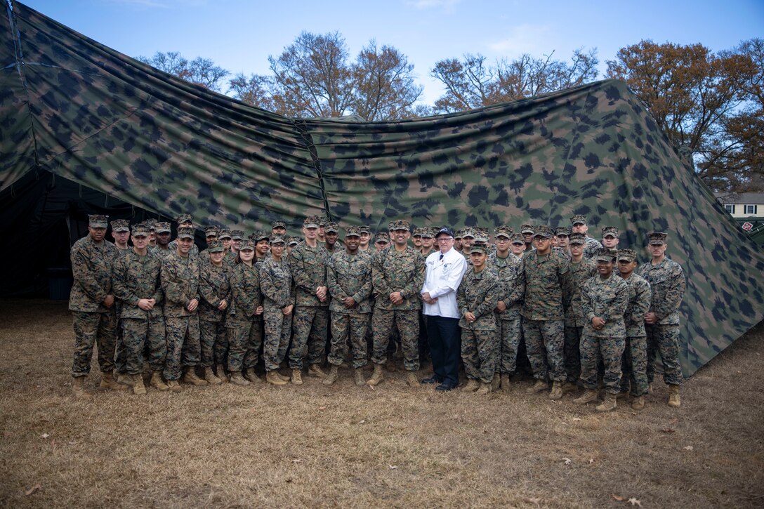 U.S. Marines with II Marine Expeditionary Force Support Battalion, II MEF Information Group, and Mr. Mike Johnson a judge with the National Restuarant Association Educational Foundation pose for a group photo after the Major General William Pendleton Thompson (W.P.T.) Hill Award Competition at Marine Corps Base Camp Lejeune, North Carolina, Dec. 19, 2024. The W.P.T. Hill awards program, established in 1985, is a competition to recognize the best food services in the Marine Corps and evaluates the preparation, food service, customer service and management. (U.S. Marine Corps photo by Cpl. Marc Imprevert)