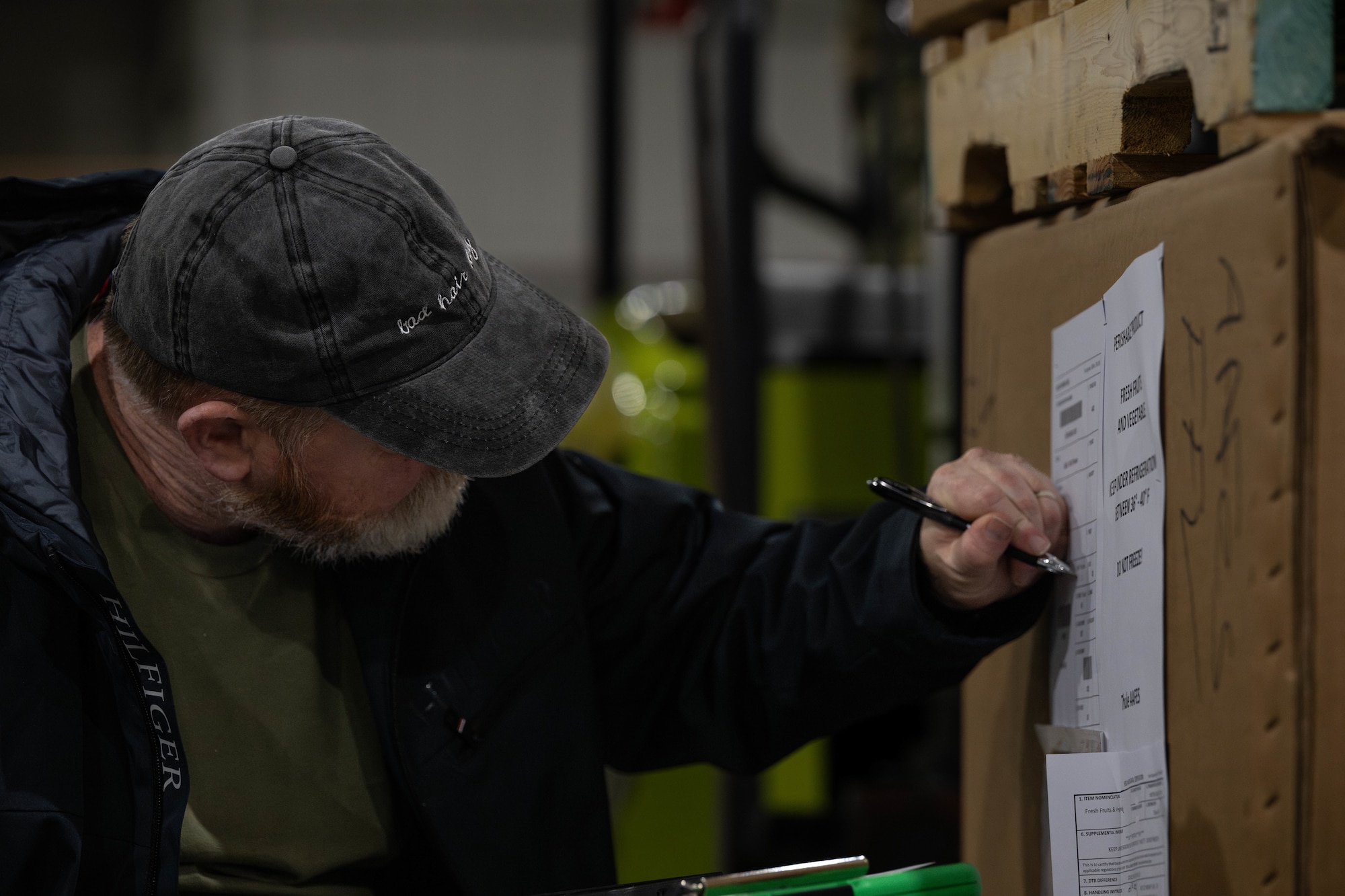 James Darnell, 305th Aerial Port Squadron special handling hazardous materials shipment inspector, documents food rations before they are palletized at Joint Base McGuire-Dix-Lakehurst, N.J., Jan. 8, 2025. The 305th Air Mobility Wing operates two of America's largest strategic aerial ports supporting the delivery of cargo and personnel to combatant commanders abroad. (U.S. Air Force photo by Senior Airman Aidan Thompson)