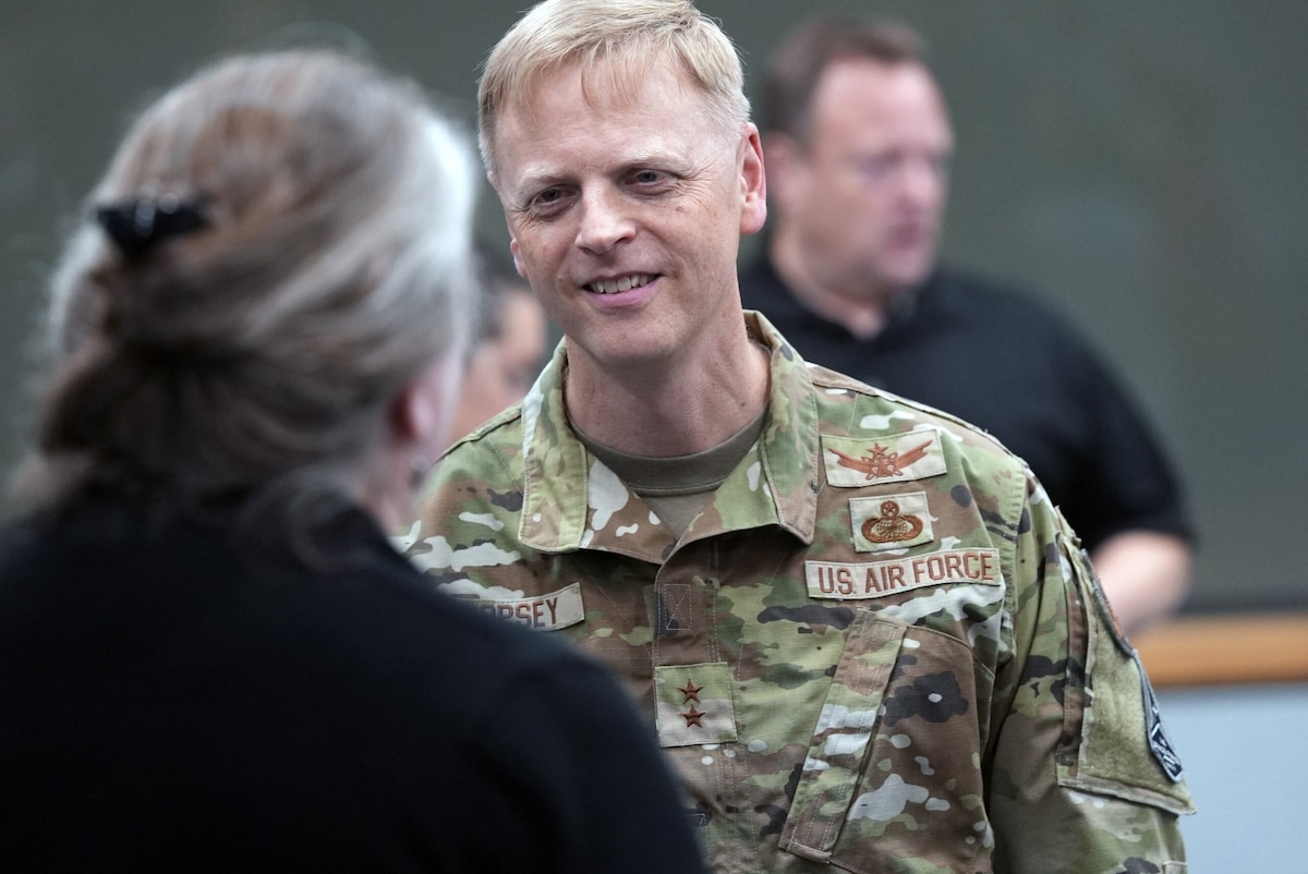 Maj Gen Luke Cropsey speaks to individuals during a recent event