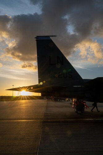an F-15 sits on the flightline