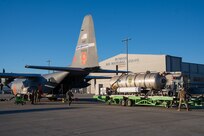 Airmen from the 152nd Maintenance and Logistics Readiness Squadron, Nevada Air National Guard, load the Modular Airborne Firefighting System tank into MAFFS 9 at the Nevada Air National Guard Base Jan. 10, 2024, to support wildland firefighting in Los Angeles.