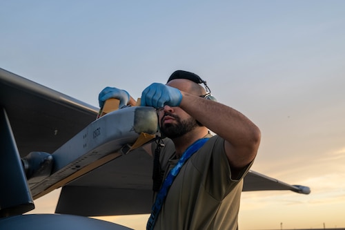 airman taping a jet
