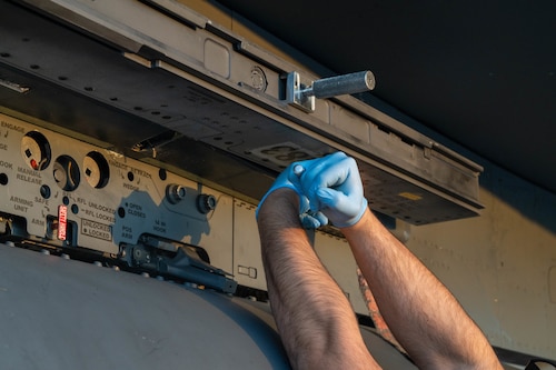 airman working on jet